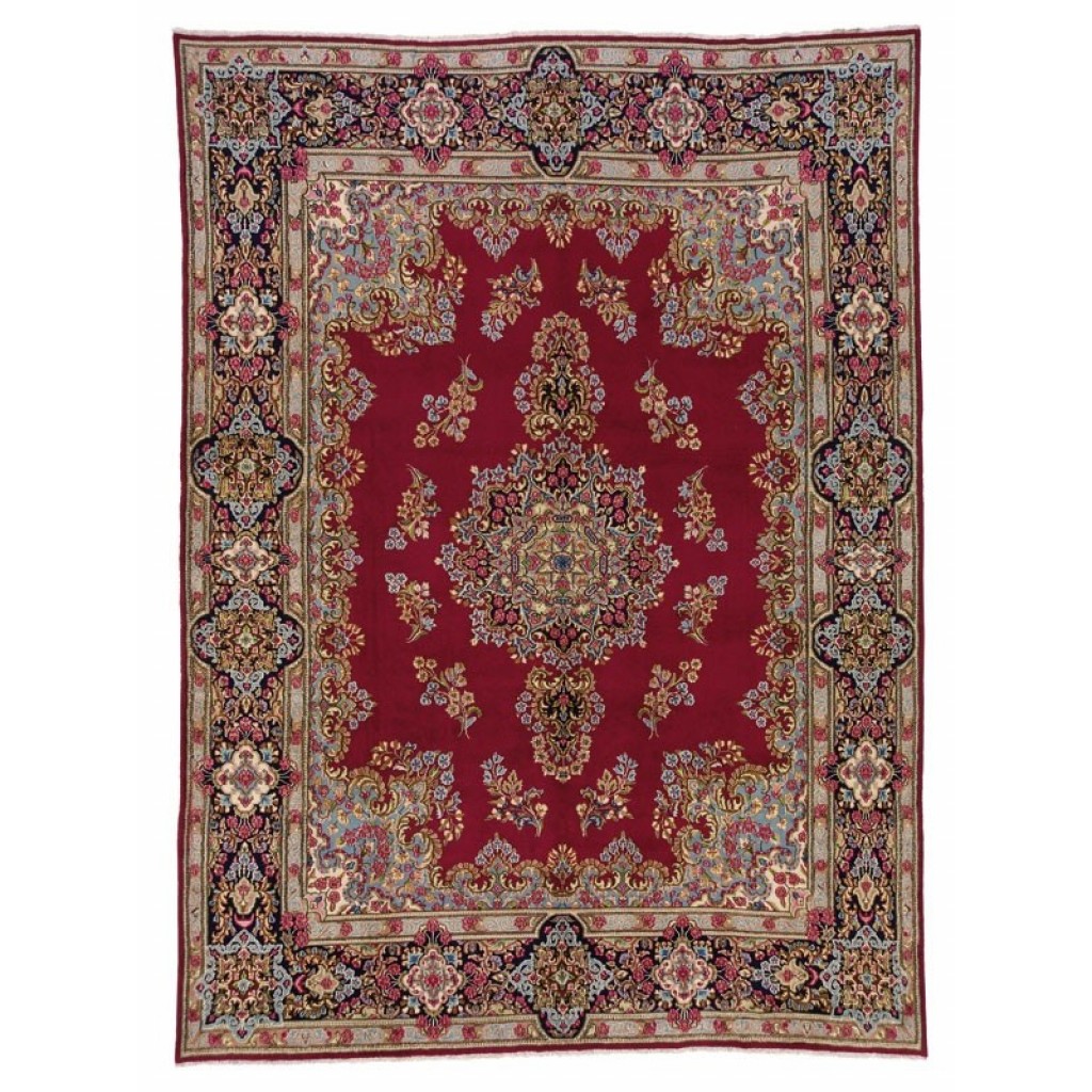 Tappeto persiano kirman imperiale con intricato medaglione centrale su sfondo rosso e dettagli decorativi elaborati sullo spesso bordo