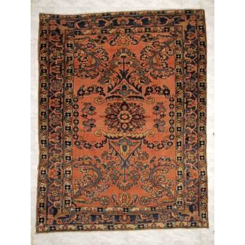 Tappeto lilian antico con medaglione centrale floreale e dettagli floreali stilizzati su fondo arancio e sullo spesso bordo arancio e blu