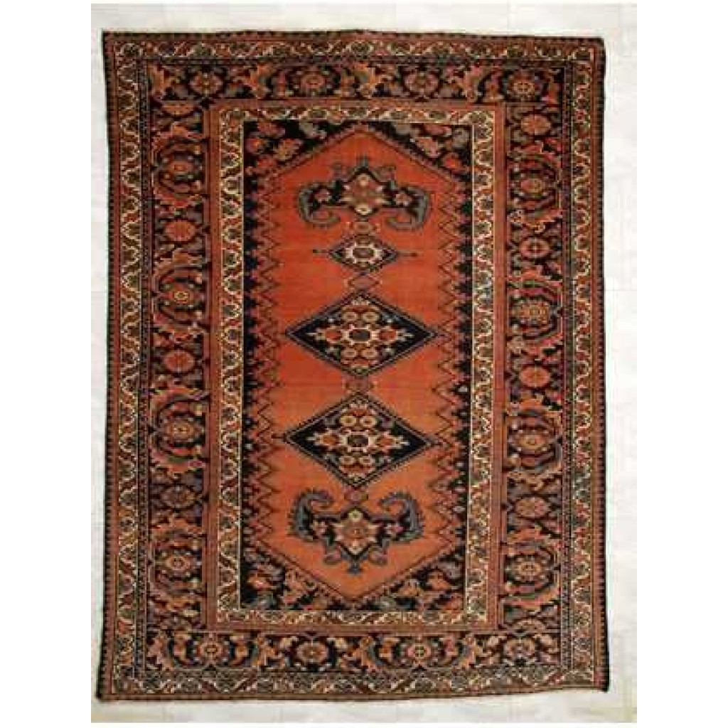 Tappeto Ferahan antico con doppio medaglione centrale su fondo arancio e dettagli decorativi floreali sullo spesso bordo
