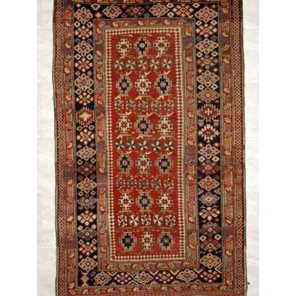 Tappeto shirvan antico con motivi decorativi geometrici a tutto campo rosso e sullo spesso bordo rosso e blu