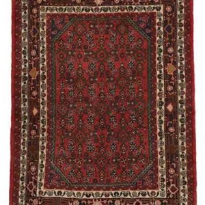 Tappeto persiano Hossenabad con decorazioni geometriche floreali a tutto campo, su sfondo rosso e con spesso bordo bianco e rosso