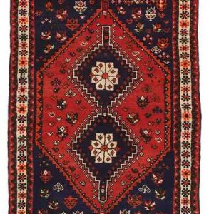tappeto persiano shiraz con doppio medaglione centrale geometrico e lineare, con decorazioni floreali astratte su sfondo rosso e blu