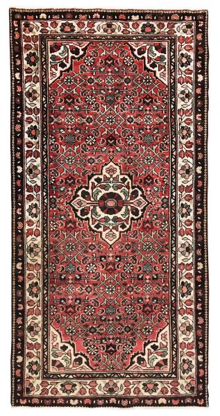 Tappeto classico hosseinabad con medaglione centrale bianco su sfondo rosso e intricati motivi decorativi floreali geometrici