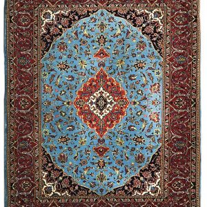 tappeto persiano keshan jehad azzurro e nero, con spesso bordo e medaglione centrale rosso, decorato con motivi floreali